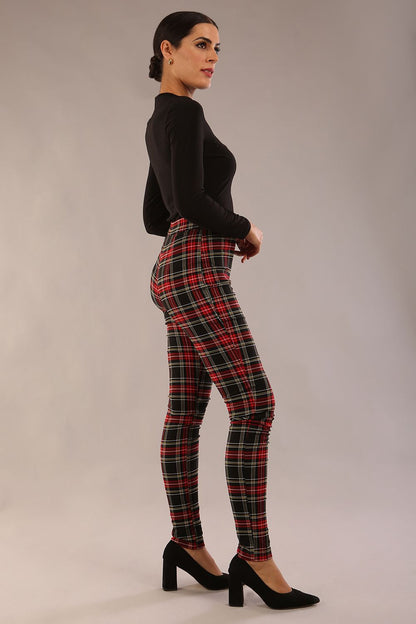 model is wearing a diva catwalk skinny fit Cressida Tartan Stretch Trousers in royal red tartan colour 