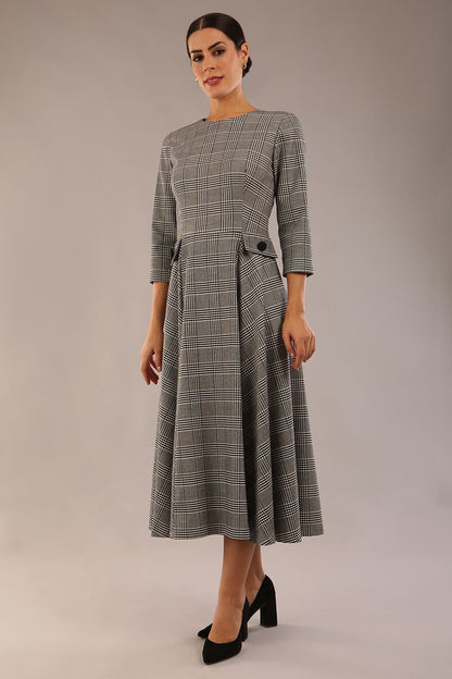 model is wearing a diva catwalk Elanore Soft-Touch Check A-Line Dress with round neckline and 3/4 sleeves midi length and faux pocket with button details in misty grey check colour  (Misty Grey check)