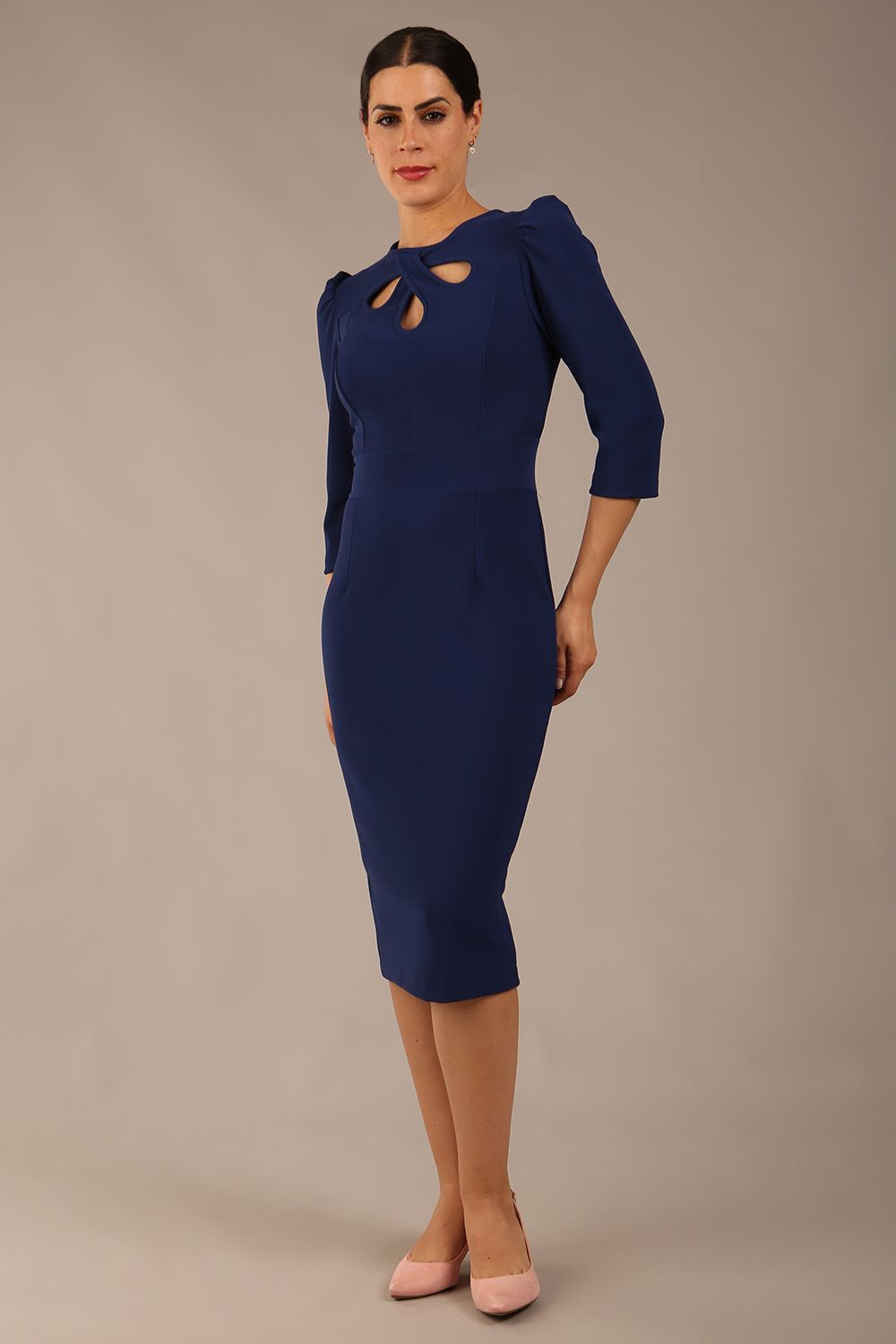 model is wearing a diva catwalk Quintessa Three Petal Keyhole Pencil Dress with 3/4 sleeves round neckline a below the knee length in navy blue colour