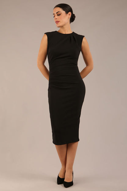 model is wearing a diva catwalk sleeveless dress with round neckline with pleating details and knee length in black colour front
