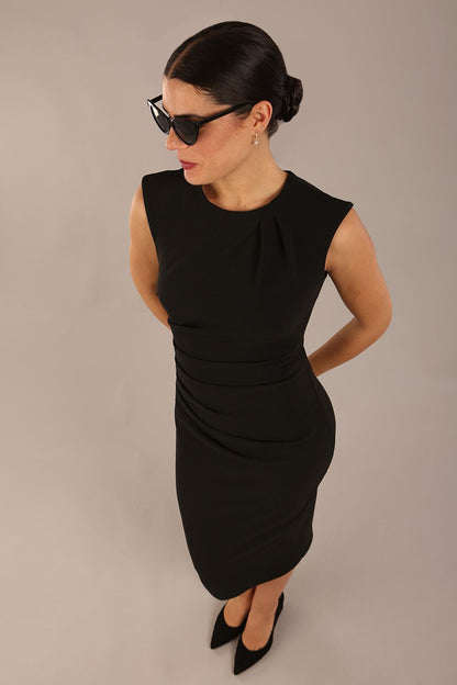 model is wearing a diva catwalk sleeveless dress with round neckline with pleating details and knee length in black colour front