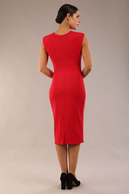 model is wearing a diva catwalk sleeveless dress with round neckline with pleating details and knee length in true red colour 