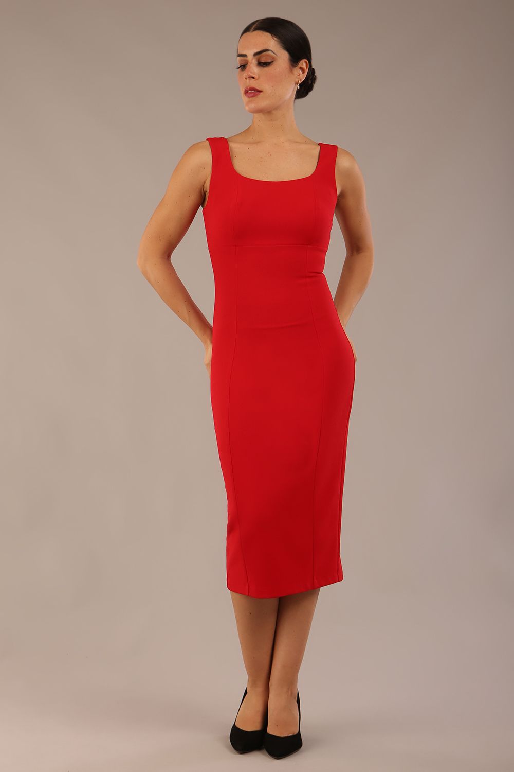 brunette model is wearing a diva catwalk Perthshire Sleeveless Bodycon Pencil Dress square neckline in passion red colour front image close up with sunglasses