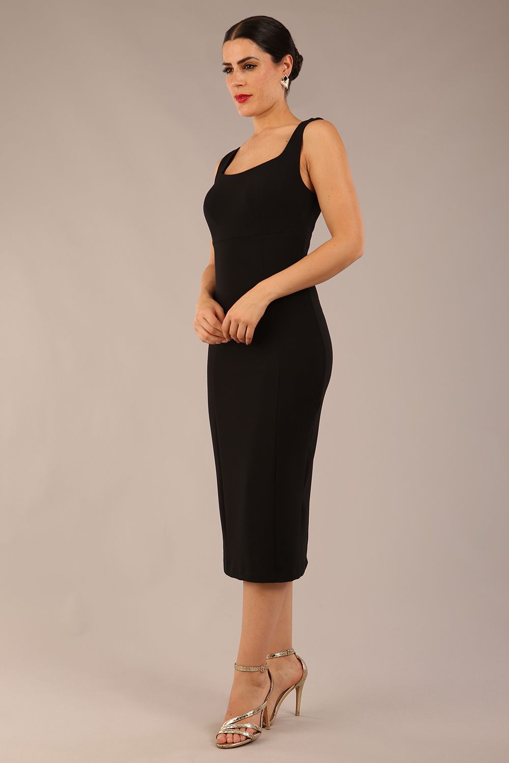 brunette model is wearing a diva catwalk Perthshire Sleeveless Bodycon Pencil Dress square neckline in black colour back image 
