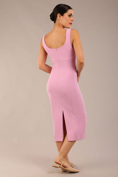 brunette model is wearing a diva catwalk Perthshire Sleeveless Bodycon Pencil Dress square neckline in dawn pink colour front image 