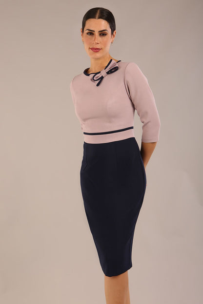 brunette model is wearing a diva catwalk Cherie Sleeved Contrast Bow Neck Pencil Dress round neckline  in Navy Blue-Thunderbird front image (Navy Blue-Thunderbird)