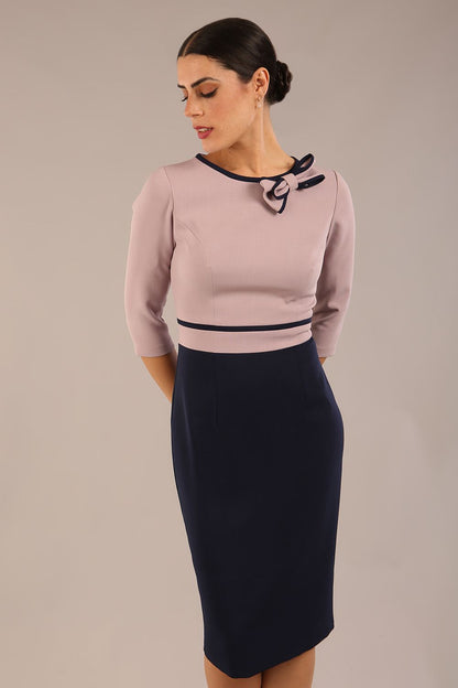 brunette model is wearing a diva catwalk Cherie Sleeved Contrast Bow Neck Pencil Dress round neckline  in Navy Blue-Thunderbird front image (Navy Blue-Thunderbird)