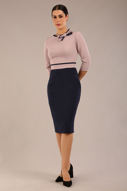 brunette model is wearing a diva catwalk Cherie Sleeved Contrast Bow Neck Pencil Dress round neckline  in Navy Blue-Thunderbird front image (Navy Blue-Thunderbird)