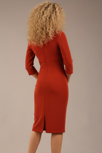 blonde model is wearing a  diva catwalk Tara V-neckline Sleeved Pencil Dress knee length in terracotta brown colour front image (Terracotta)