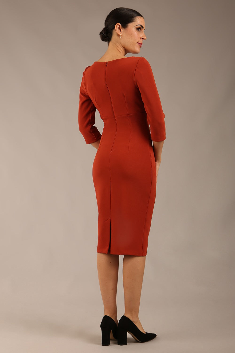blonde model is wearing a  diva catwalk Tara V-neckline Sleeved Pencil Dress knee length in terracotta brown colour front image (Terracotta)