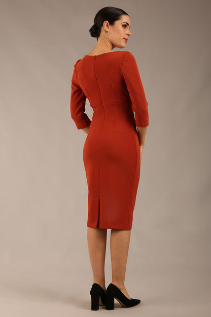blonde model is wearing a  diva catwalk Tara V-neckline Sleeved Pencil Dress knee length in terracotta brown colour front image (Terracotta)