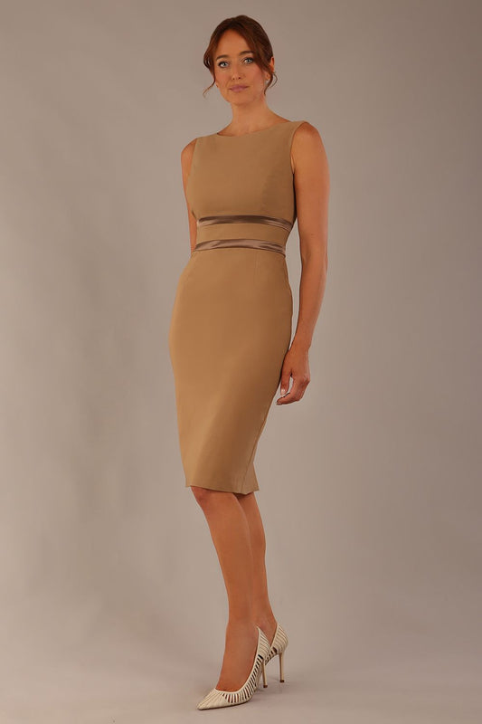 brunette model is wearing a divacatwalk Bijou Sleeveless Bodycon Pencil Dress with Satin Detail roun neckkline knee length in super stretch fabric in tannin brown colour front image (Tannin Brown - Pebble Satin)