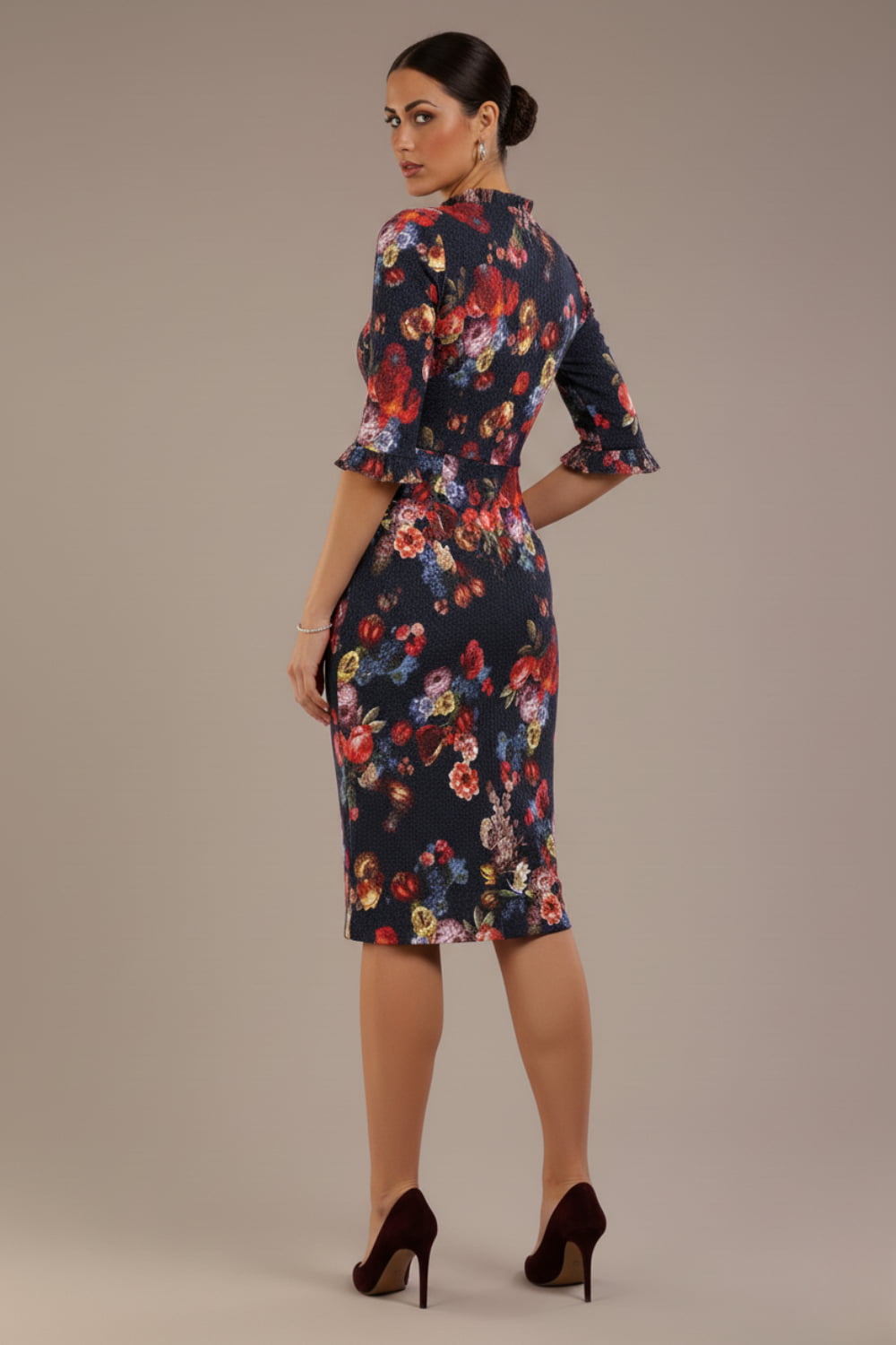 Model wearing the Portofino frill neck floral jacquard dress against a plain background (Hidcote Floral)
