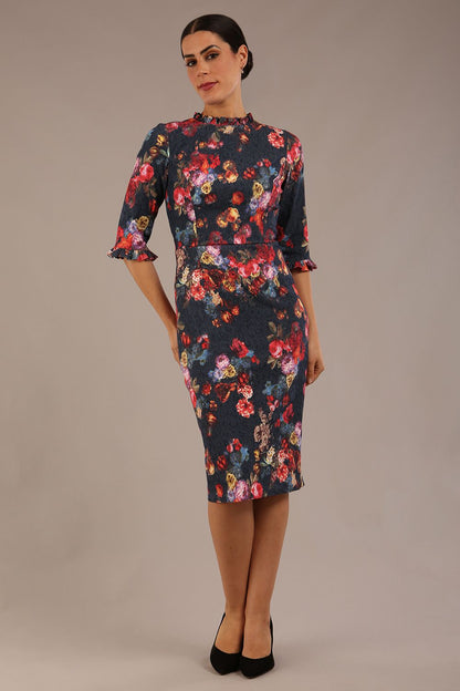 Model wearing the Portofino frill neck floral jacquard dress against a plain background (Hidcote Floral)