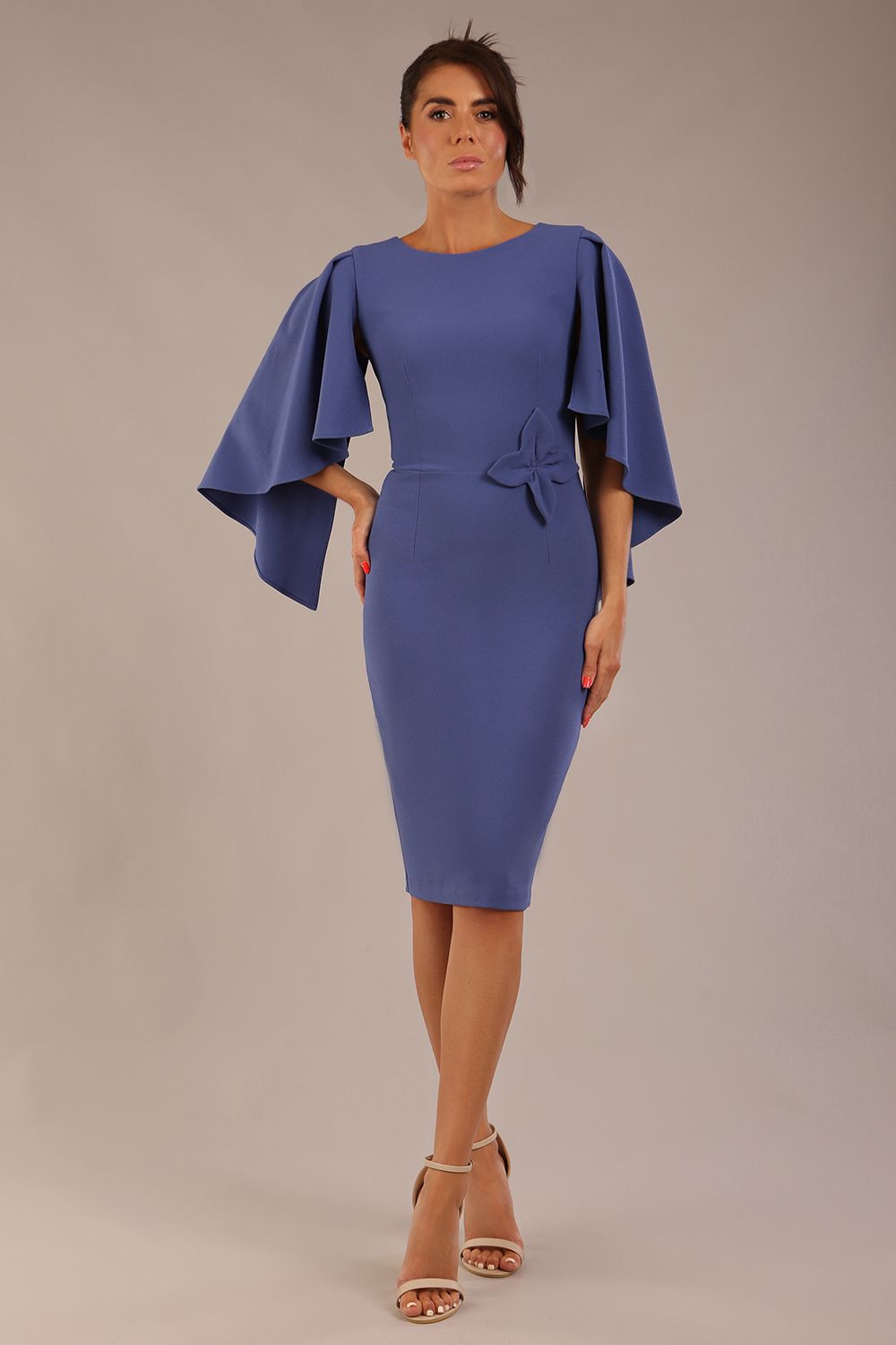 brunette model is wearing a diva catwalk Luella Dolman Sleeve Knee-Length Pencil Dress round neckline with a Four-petal floral detail at the waist and Soft V-shaped back neckline in dutch blue colour front  (Dutch Blue)
