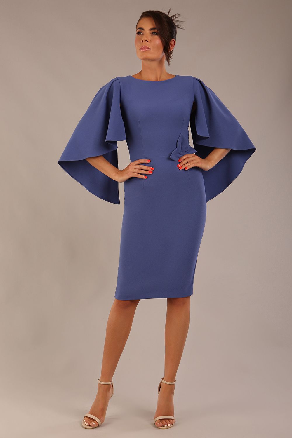brunette model is wearing a diva catwalk Luella Dolman Sleeve Knee-Length Pencil Dress round neckline with a Four-petal floral detail at the waist and Soft V-shaped back neckline in dutch blue colour front  (Dutch Blue)