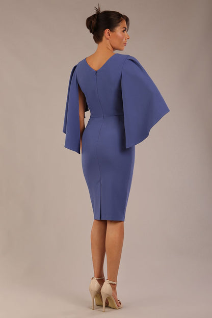 brunette model is wearing a diva catwalk Luella Dolman Sleeve Knee-Length Pencil Dress round neckline with a Four-petal floral detail at the waist and Soft V-shaped back neckline in dutch blue colour front  (Dutch Blue)