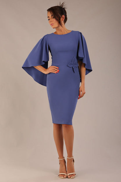 brunette model is wearing a diva catwalk Luella Dolman Sleeve Knee-Length Pencil Dress round neckline with a Four-petal floral detail at the waist and Soft V-shaped back neckline in dutch blue colour front  (Dutch Blue)