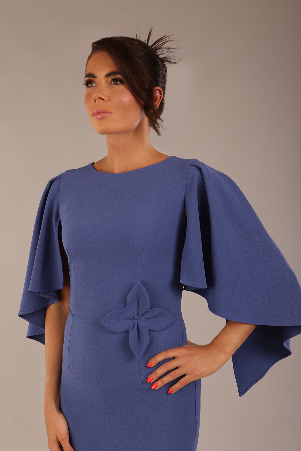 brunette model is wearing a diva catwalk Luella Dolman Sleeve Knee-Length Pencil Dress round neckline with a Four-petal floral detail at the waist and Soft V-shaped back neckline in dutch blue colour front  (Dutch Blue)