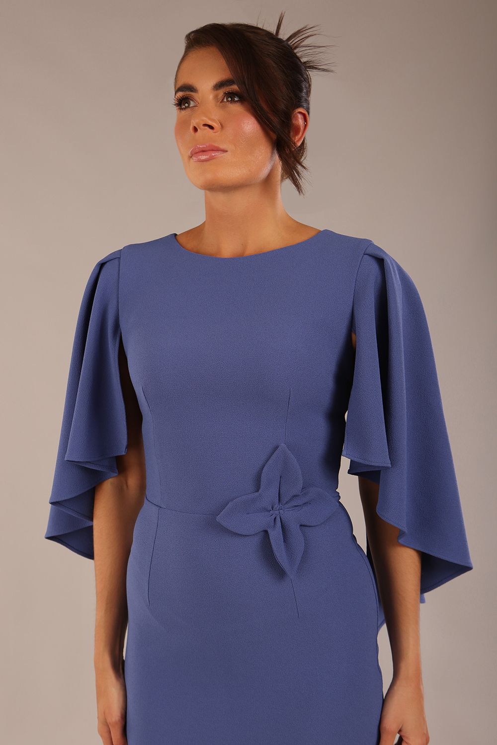 brunette model is wearing a diva catwalk Luella Dolman Sleeve Knee-Length Pencil Dress round neckline with a Four-petal floral detail at the waist and Soft V-shaped back neckline in dutch blue colour front  (Dutch Blue)