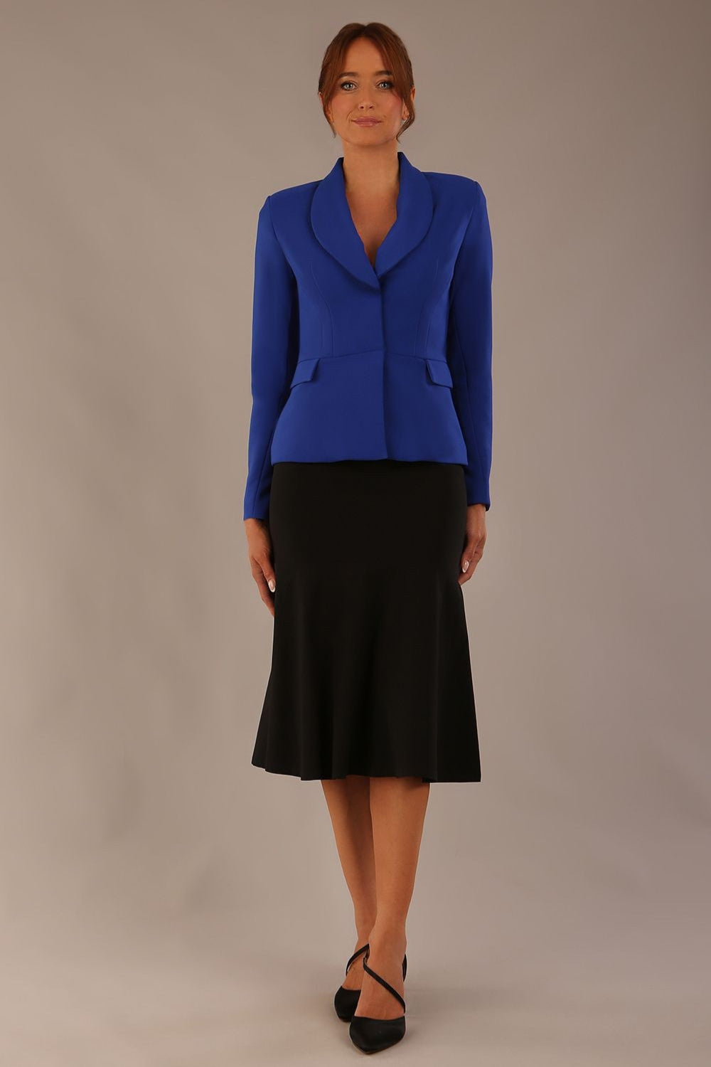 Model wearing the Melberry tailored jacket in royal blue, showing the sculpted waist and statement lapel detail (Royal Blue)