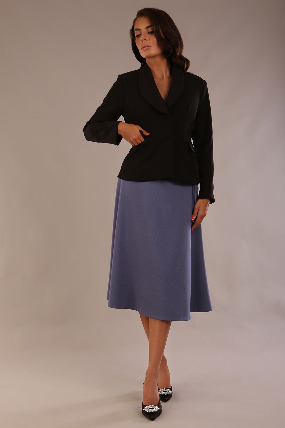 Close-up front view of the Melberry statement jacket in black, showing the flap pocket and fabric-covered buttons (Black)