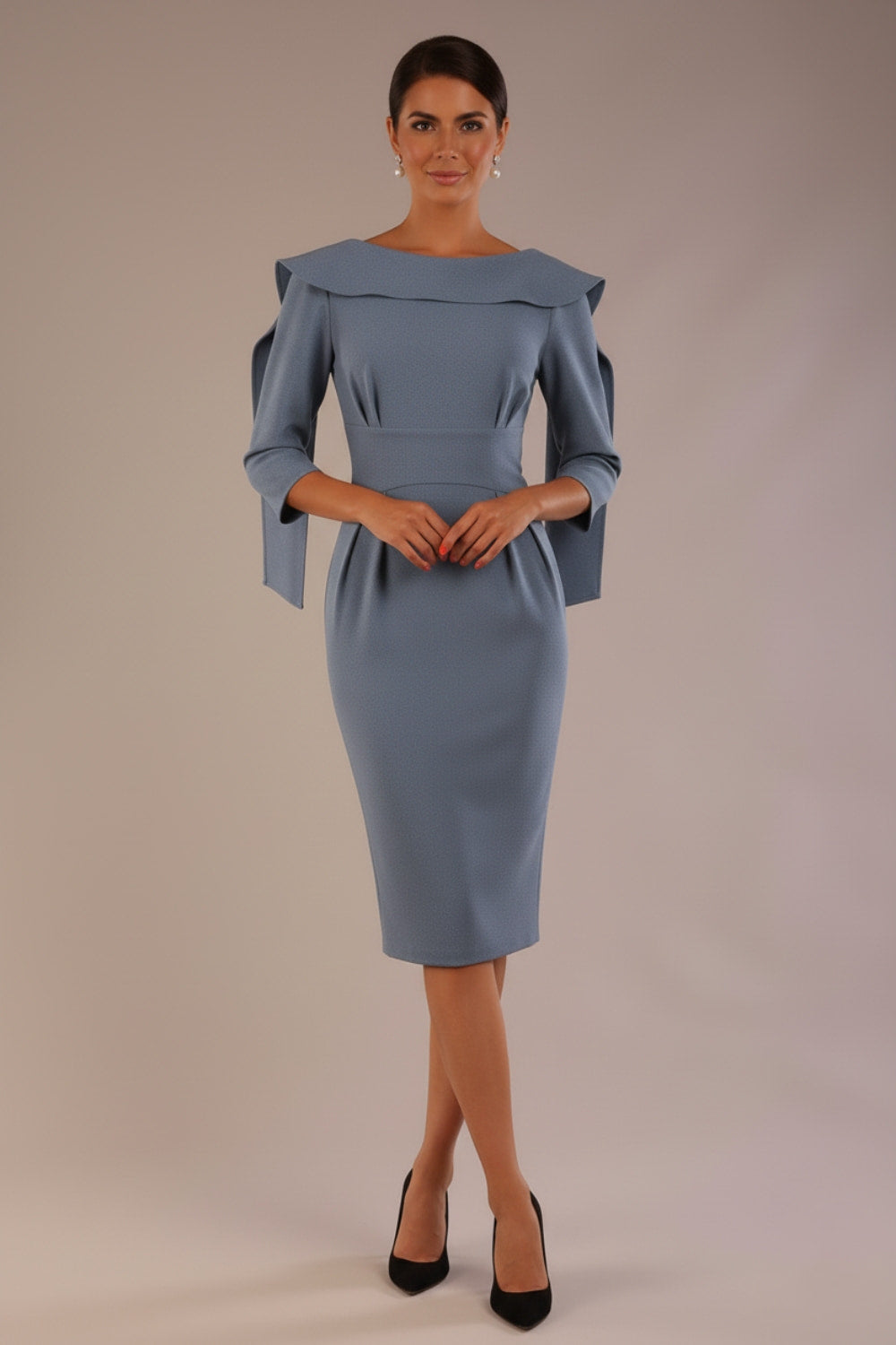 Model wearing the Rio statement collar pencil dress in blue mineral, showcasing its architectural silhouette (Blue Mineral)