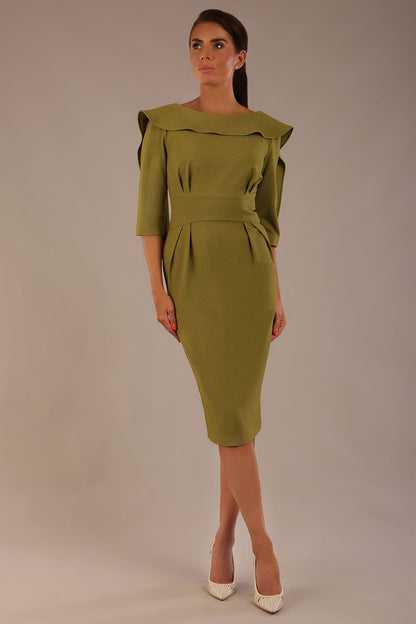 Model wearing the Rio statement collar pencil dress in oasis green, showcasing its architectural silhouette (Oasis Green)