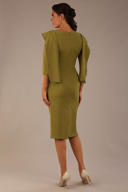 Model wearing the Rio statement collar pencil dress in oasis green, showcasing its architectural silhouette (Oasis Green)