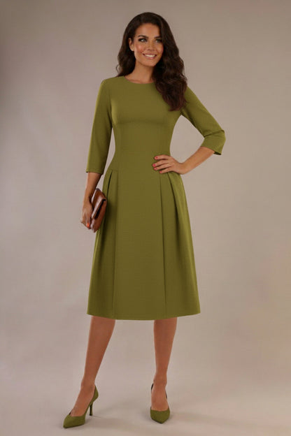 Woman wearing a green dress with a plain background (Oasis Green)
