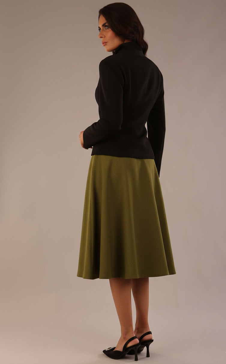 Model wearing the Harlow A-line midi skirt in oasis green, with the side-tie fastened in a bow (Oasis Green)