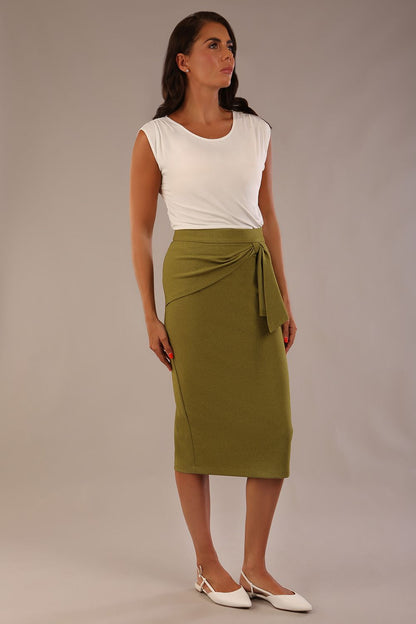 Model wearing an Oasis Green Hedy pencil skirt with a draped front and a sophisticated floral top (Oasis Green)