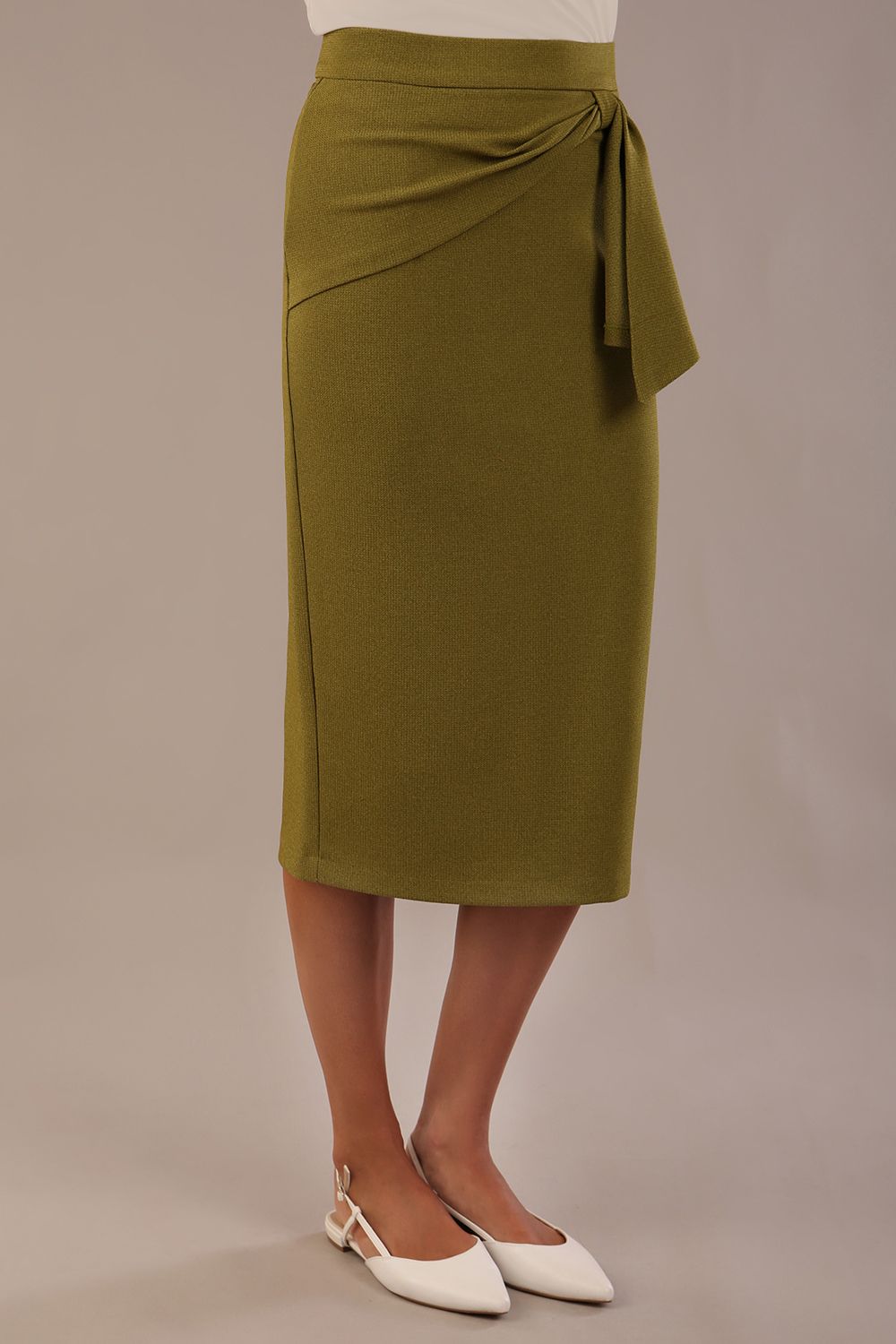 Model wearing an Oasis Green Hedy pencil skirt with a draped front and a sophisticated floral top (Oasis Green)