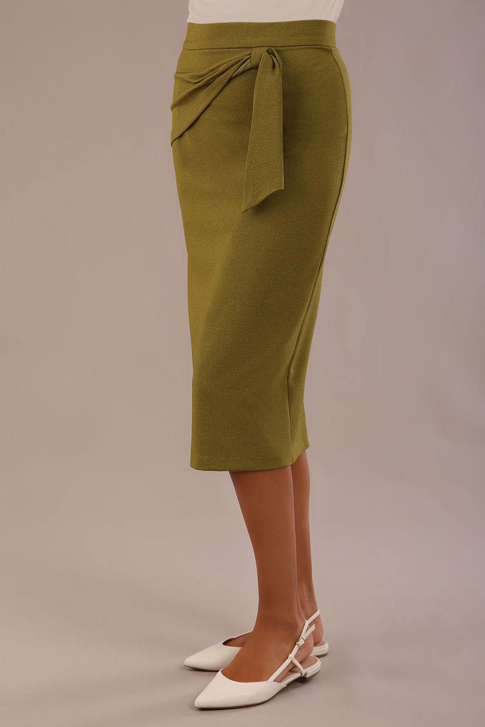 Model wearing an Oasis Green Hedy pencil skirt with a draped front and a sophisticated floral top (Oasis Green)