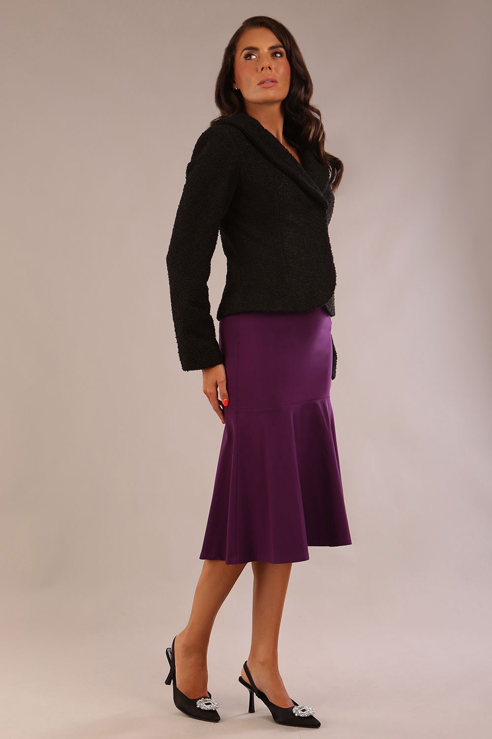 Model wearing the Teddy Luxe Boucle Jacket in black, showcasing its elegant shawl collar and textured fabric (Black)