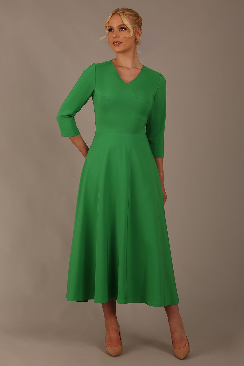  Model wearing the Nova V-neck A-line midaxi dress in vibrant (Jelly Bean Green)