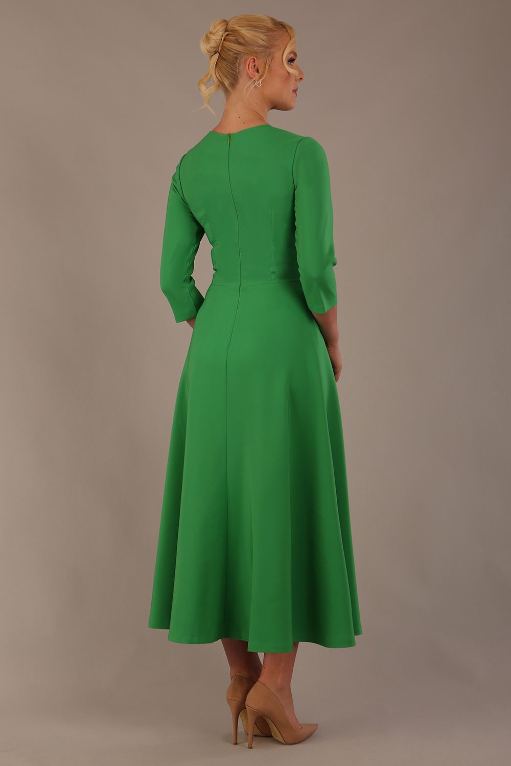  Model wearing the Nova V-neck A-line midaxi dress in vibrant (Jelly Bean Green)