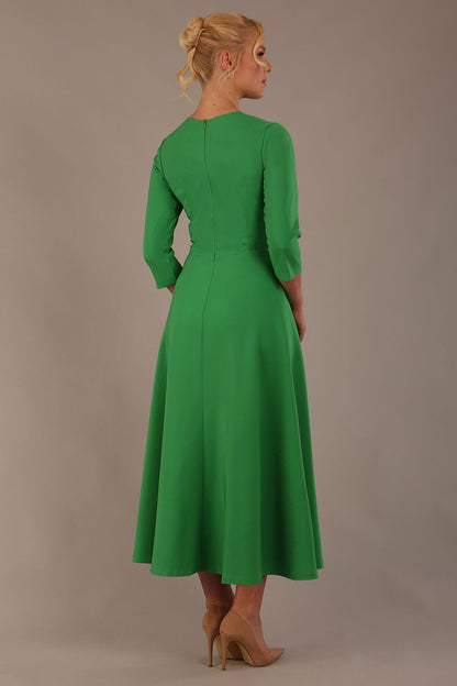  Model wearing the Nova V-neck A-line midaxi dress in vibrant (Jelly Bean Green)