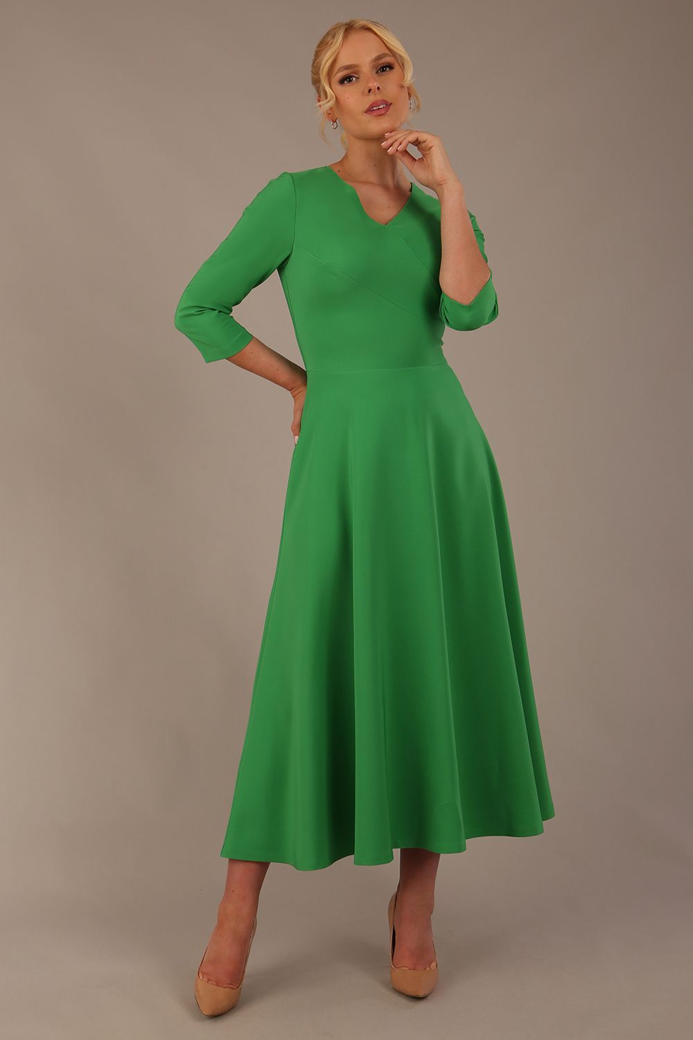  Model wearing the Nova V-neck A-line midaxi dress in vibrant (Jelly Bean Green)