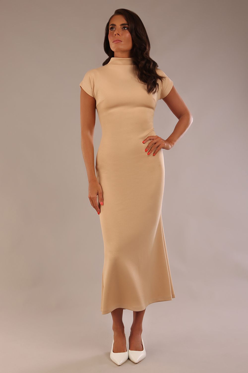 Model wearing the Kaden high neck midaxi dress in cafe au lait cream, showing the sleek silhouette and cap sleeves. against a plain background (Cafe au Lait Cream)
