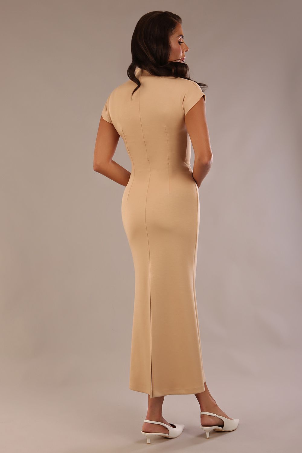 Model wearing the Kaden high neck midaxi dress in cafe au lait cream, showing the sleek silhouette and cap sleeves. against a plain background (Cafe au Lait Cream)