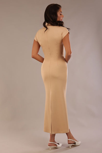 Model wearing the Kaden high neck midaxi dress in cafe au lait cream, showing the sleek silhouette and cap sleeves. against a plain background (Cafe au Lait Cream)