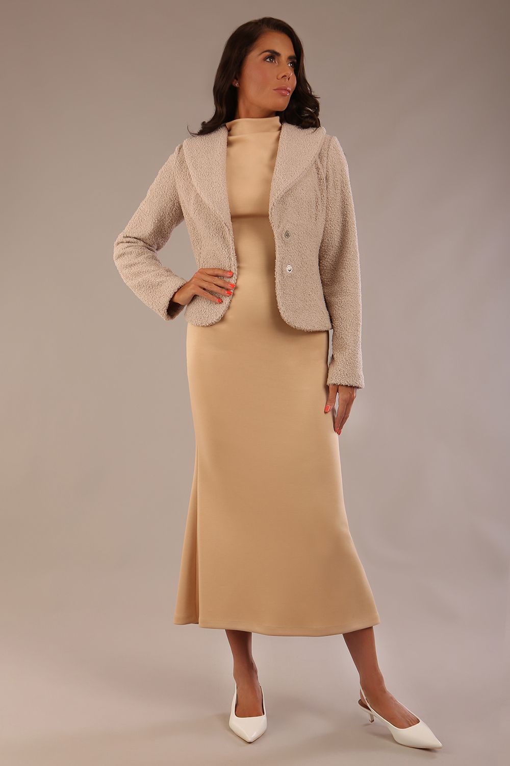 Model wearing the Kaden high neck midaxi dress in cafe au lait cream, showing the sleek silhouette and cap sleeves. against a plain background (Cafe au Lait Cream)