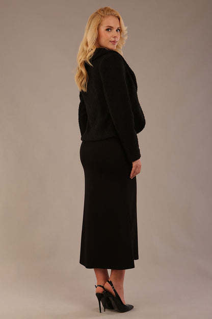 Model wearing the Teddy Luxe Boucle Jacket in black, showcasing its elegant shawl collar and textured fabric (Black)