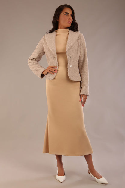 Model wearing the Teddy Luxe Boucle Jacket in pink tint, styled over a cream pencil dress close up (Pink Tint)