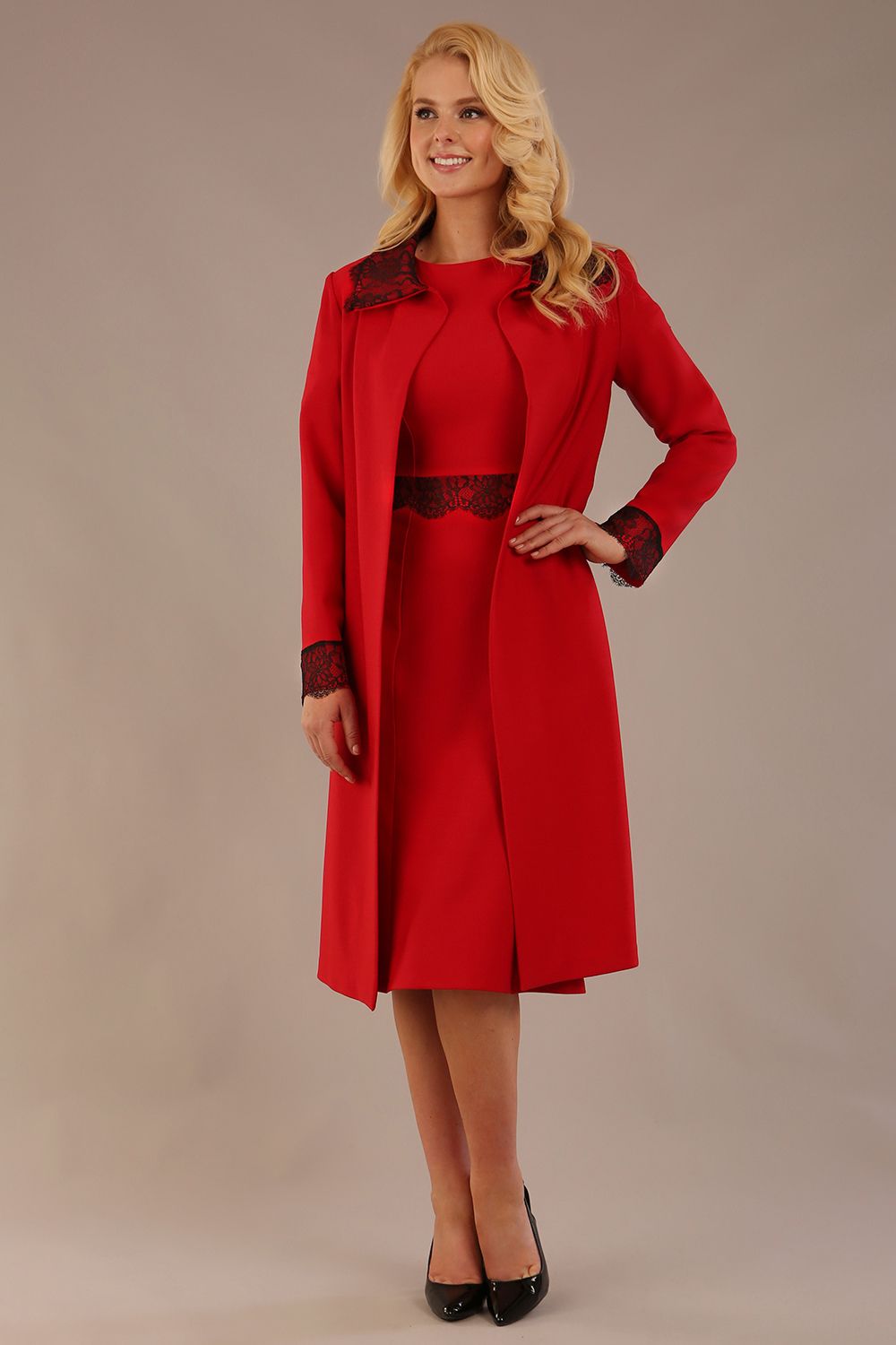 Model wearing the Haven lace trim midi coat in salsa red, styled with the matching Lovell dress (Salsa Red)