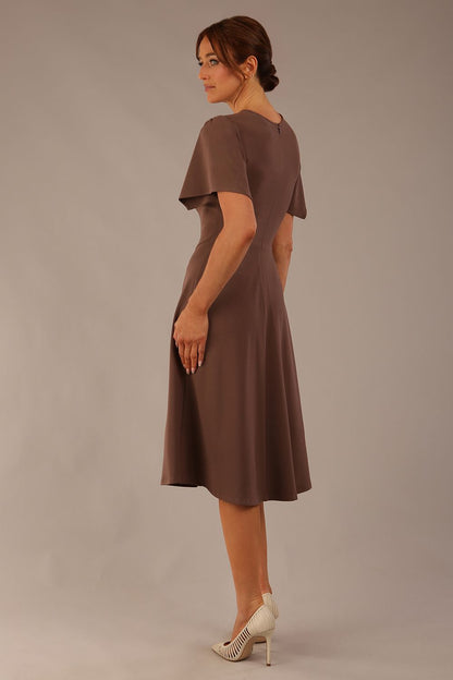 Model wearing a diva catwalk Anders petal sleeve A-line dress against a plain background (Peppercorn Brown)
