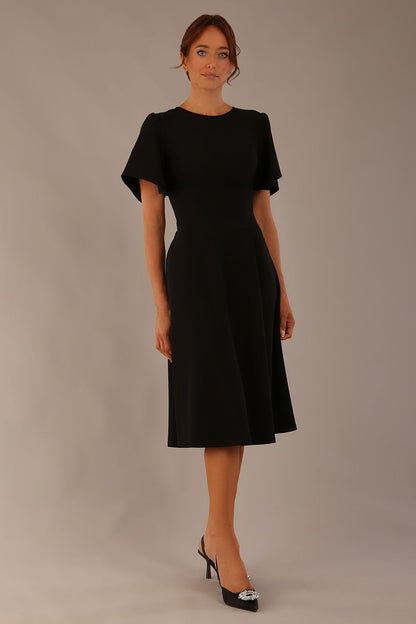 Model wearing a diva catwalk Anders petal sleeve A-line dress against a plain background (Black)