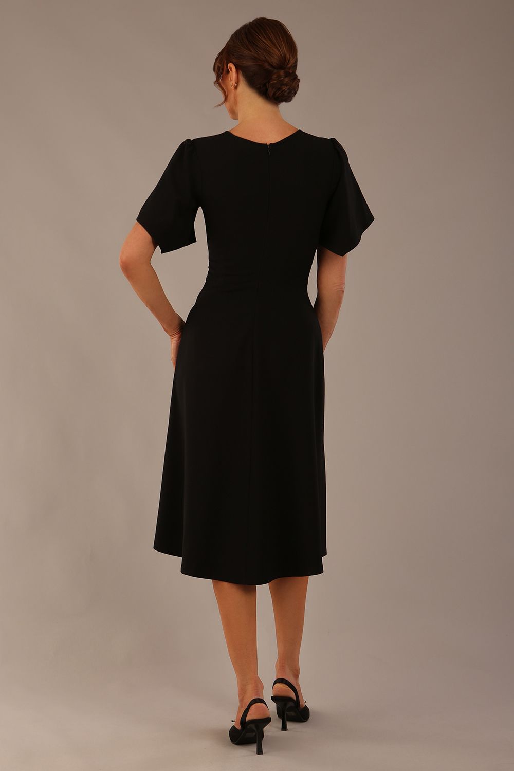 Model wearing a diva catwalk Anders petal sleeve A-line dress against a plain background (Black)