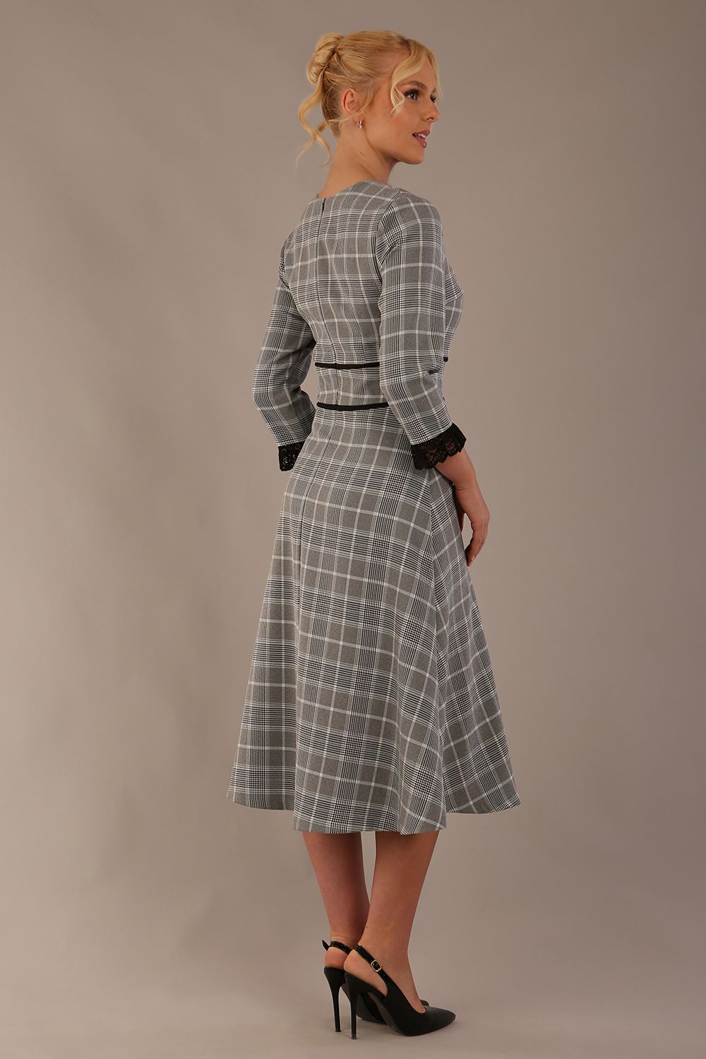Model wearing the Hendricks check midi dress in misty grey with black lace cuffs and a V-neck (Misty Grey Check)
